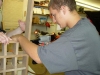 Son using brad nailer